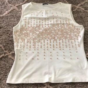Sleeveless ivory shirt with beading